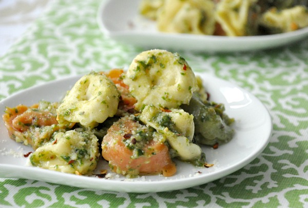 Spoon this garlicky arugula pesto over cheesy tortellini, brush onto crusty french bread, or slather on flaky salmon fillets for pure pesto deliciousness!