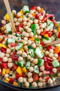 Loaded with fresh veggies and tossed in a light homemade dressing, this tasty vegetarian Greek Chickpea Salad makes healthy eating a breeze! Let's get Mediterranean!