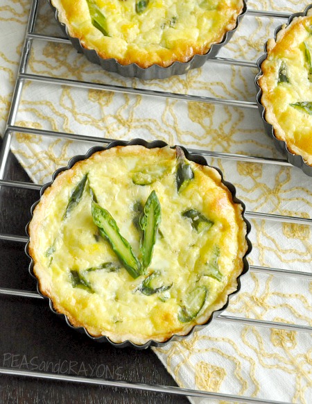 This fluffy asparagus quiche is speckled with feta and perfect for your next breakfast or brunch. As for the crust? It's the easiest you'll ever make!