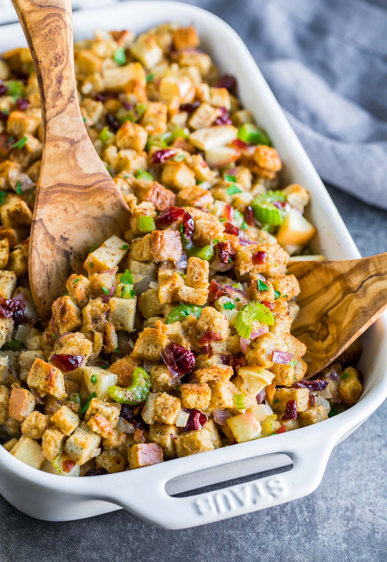 This sweet and savory baked apple cranberry stuffing combines the best of both worlds! Sweet apples and cranberries kissed with cinnamon and baked into a warm Thanksgiving stuffing... it's DELICIOUS.