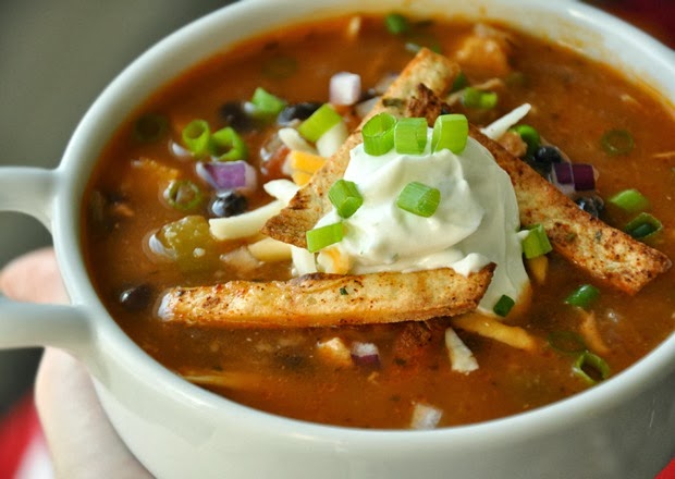 photo of chicken tortilla soup with sour cream on top