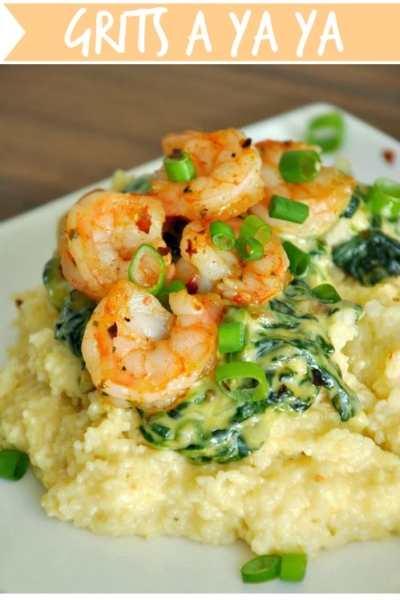 Shrimp and Grits a Ya Ya :: tasty gouda grits topped with a creamy spinach sauce and fresh shrimp - this restaurant copycat has it all!