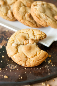 These are hands-down best Peanut Butter Macadamia Nut White Chocolate Cookies of my life! They're crispy on the edges, soft and chewy in the center, and loaded with melty peanut butter chips!