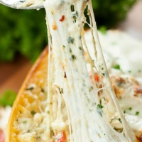 I'm obsessed with this cheesy pesto chicken lasagna stuffed spaghetti squash!