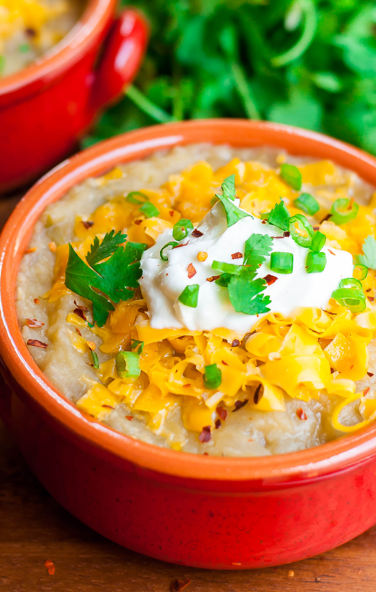This slow cooker Mexican Baked Potato Soup will warm you up on a cool day with its healthy and delicious twist on classic baked potato soup!