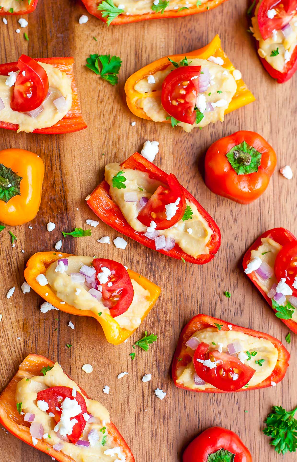 Quick, easy, and totally tasty, these healthy hummus stuffed peppers are sure to be a hit at your next party!