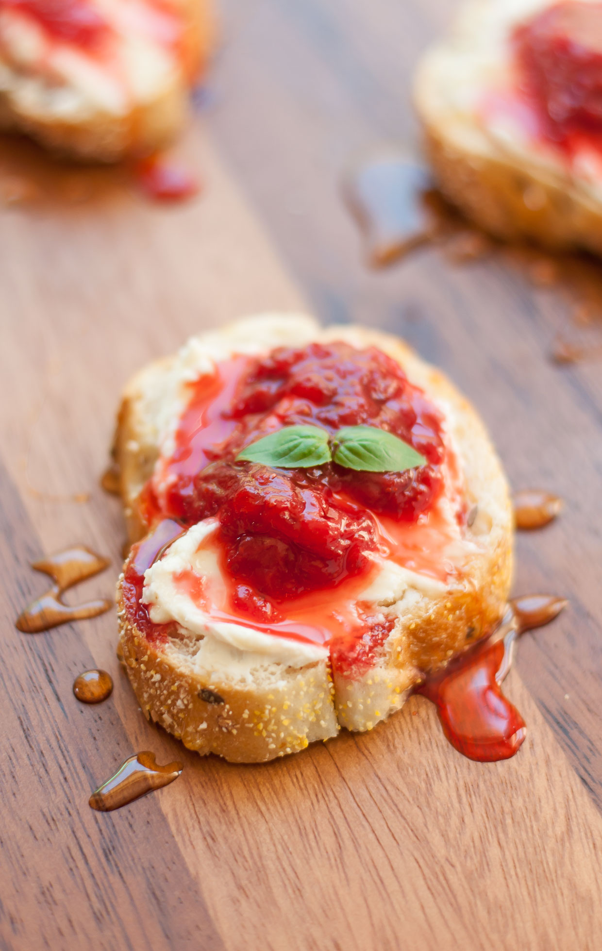 Whipped Honey Goat Cheese Crostini with Simple Strawberry Sauce :: This speedy crostini is ready to take your brunch game to the next level!