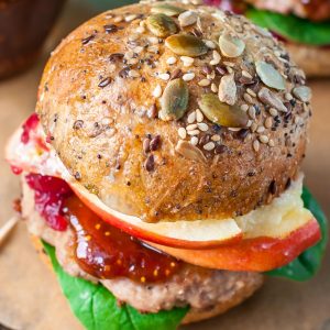 These tasty turkey burgers  are topped with apples, cranberry, and brie, then served up slider-style with fig preserves. SO GOOD!