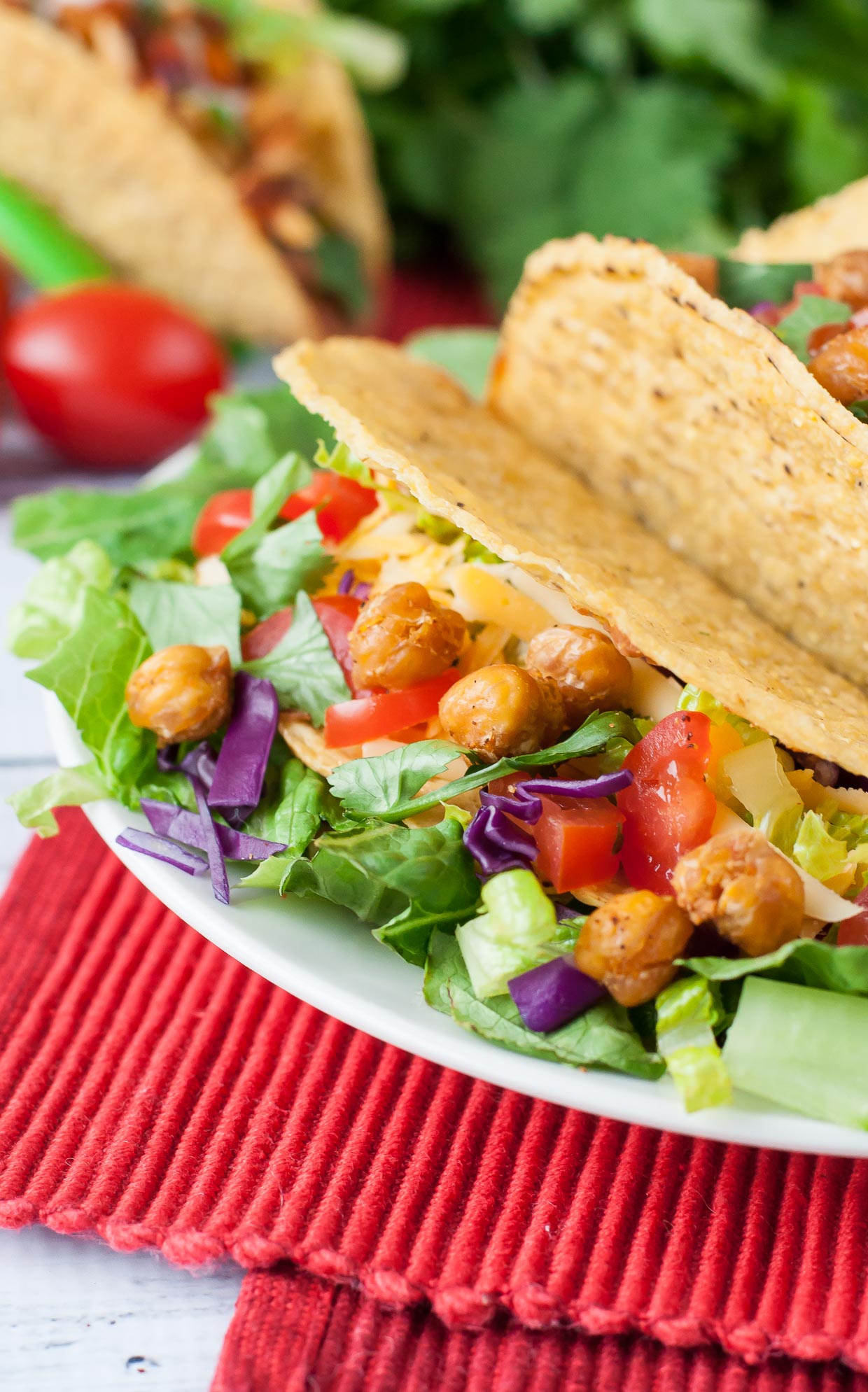 Seasoned black beans, pinto beans, and crunchy taco-roasted chickpeas team up to take your taco game to the next level with these tasty vegetarian triple bean tacos!