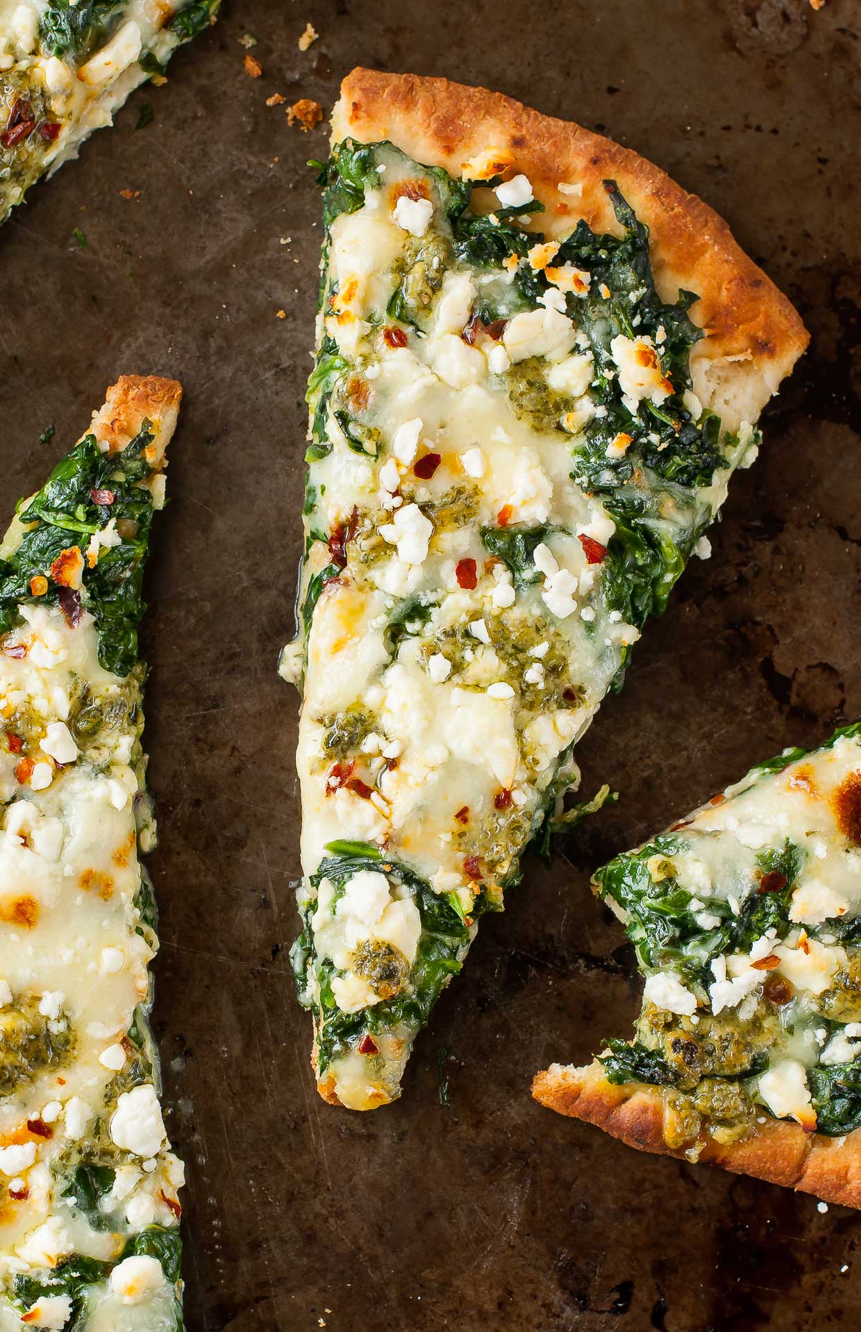 Three Cheese Pesto Spinach Flatbread Pizza. Alternate title: how to eat an entire 5oz box of spinach for lunch with out making a frickin' salad.