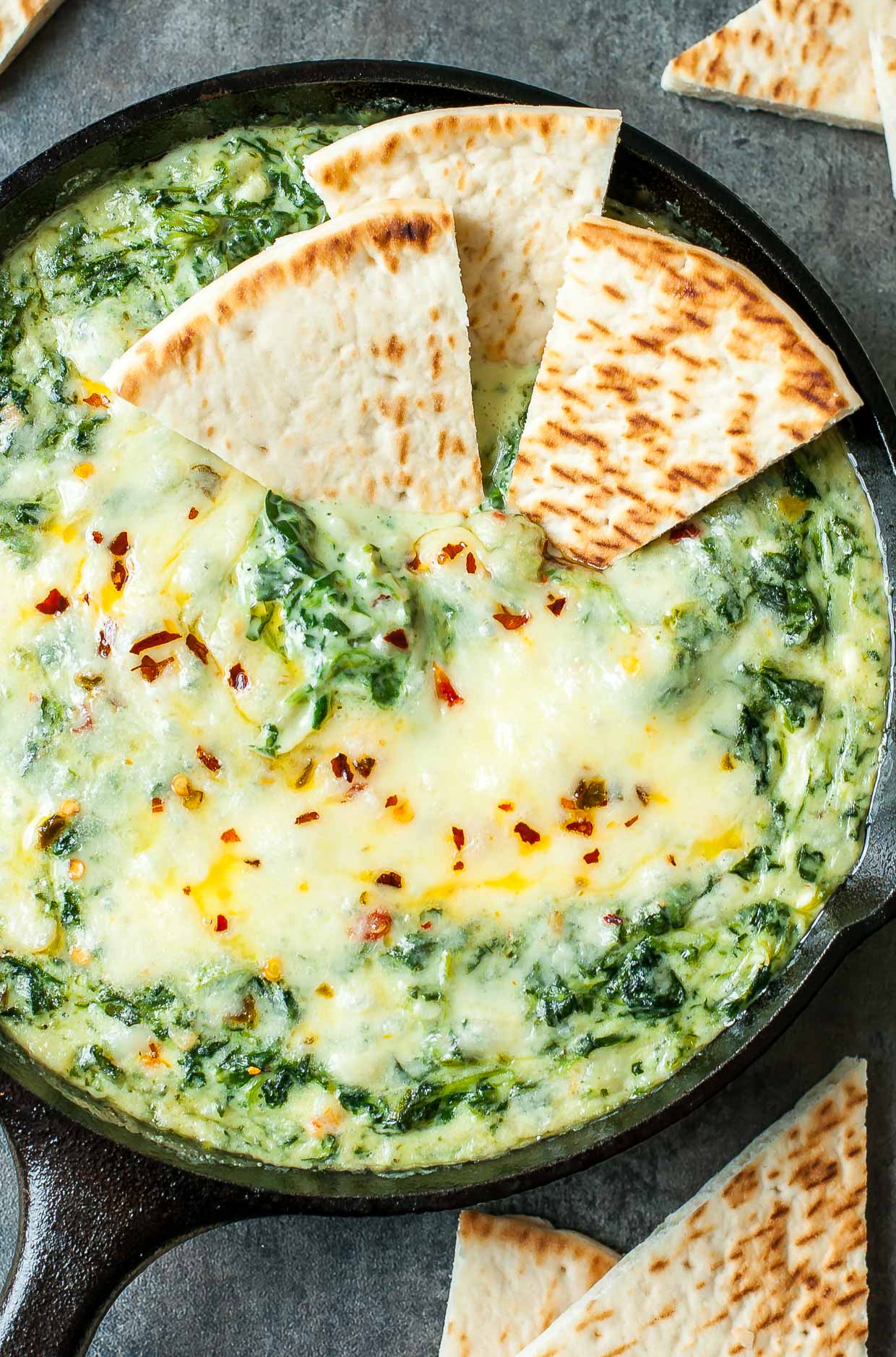 Serve this Cheesy Baked Shrimp and Spinach Dip at your next party and it's sure to be the first dish devoured! My friends and family BEG for this easy cheesy appetizer!