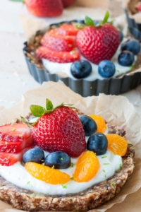 Entertain effortlessly with these healthy no-bake coconut lime fruit and yogurt tarts. They're gluten-free and naturally sweet!