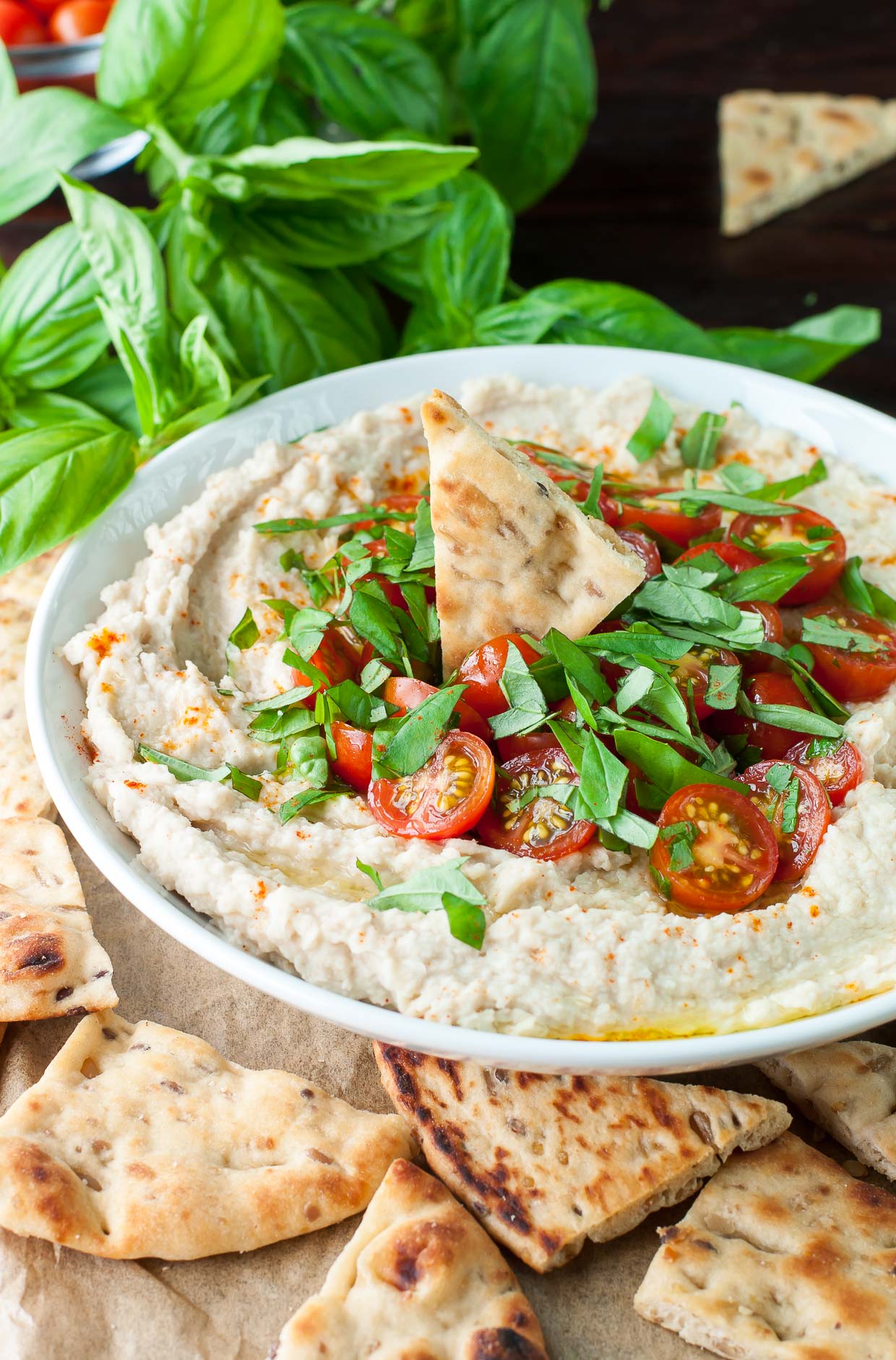 Tomato Basil White Bean Dip :: This easy breezy appetizer doubles as a healthy snack! It comes together in just minutes and can be made/prepped in advance too. Pop leftovers in the fridge for an extra snack sesh or two throughout the week.