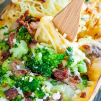 This Cheesy Bacon Broccoli Stuffed Spaghetti Squash is stuffed to the brim with tender broccoli, crispy bacon, and melted cheese.