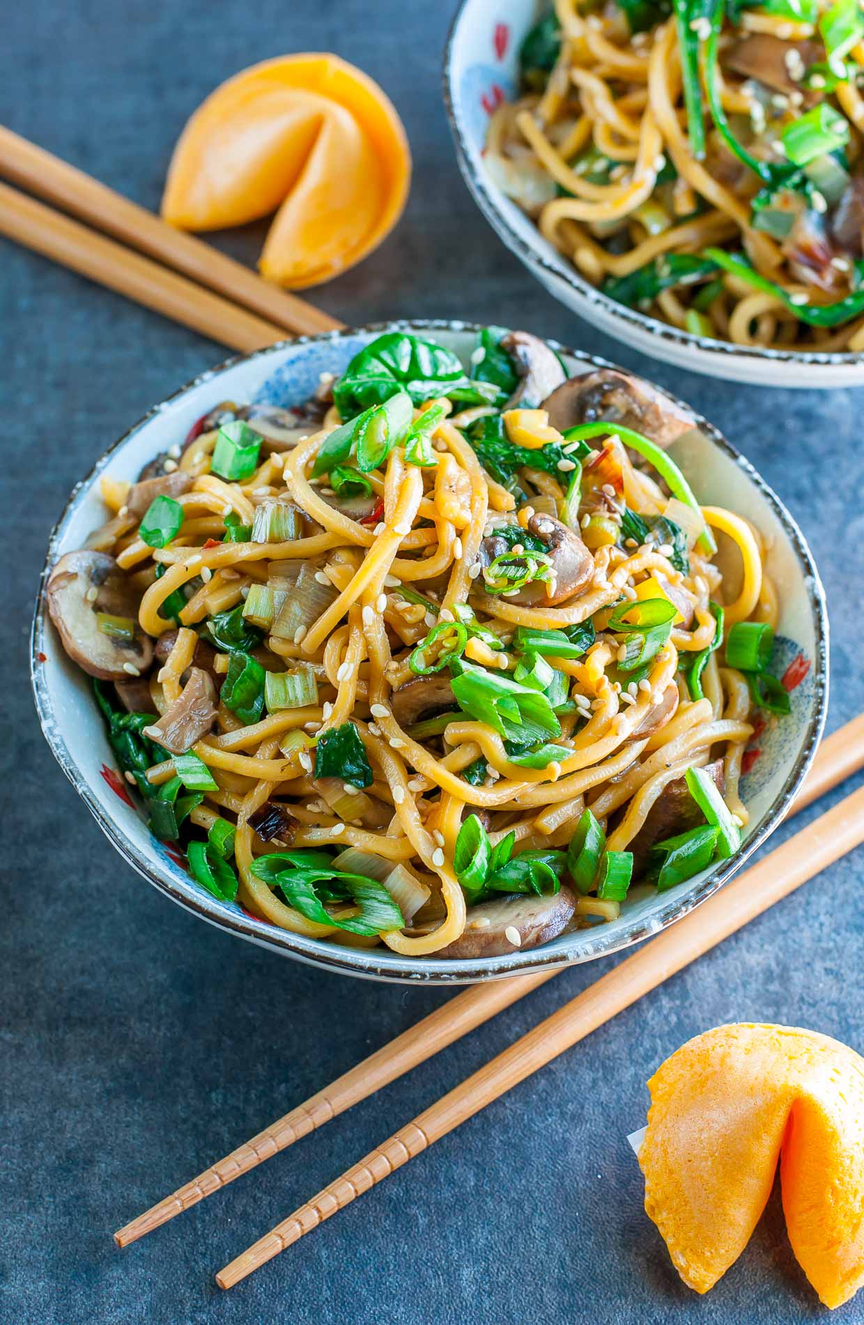 Take-out inspired Spinach Mushroom Leek Noodle Bowls tossed in the most amazing homemade sesame sauce. Pair with your favorite protein, or enjoy all on it's own as a tasty vegan/vegetarian main or side!