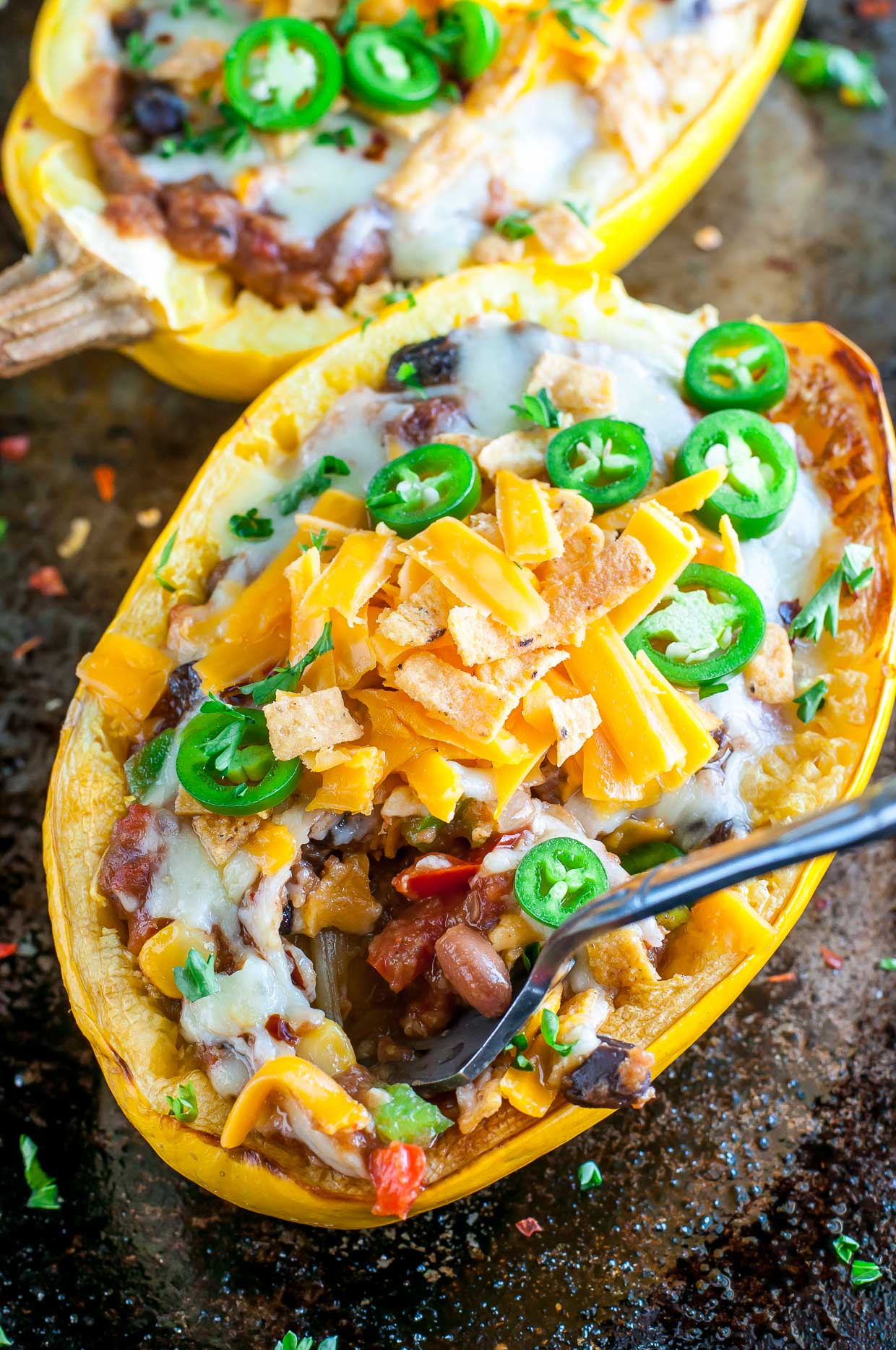 These easy cheesy Chili Stuffed Spaghetti Squash are 100% vegetarian and totally crave-worthy! 