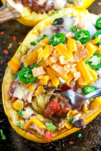 These easy cheesy Chili Stuffed Spaghetti Squash are 100% vegetarian and totally crave-worthy!