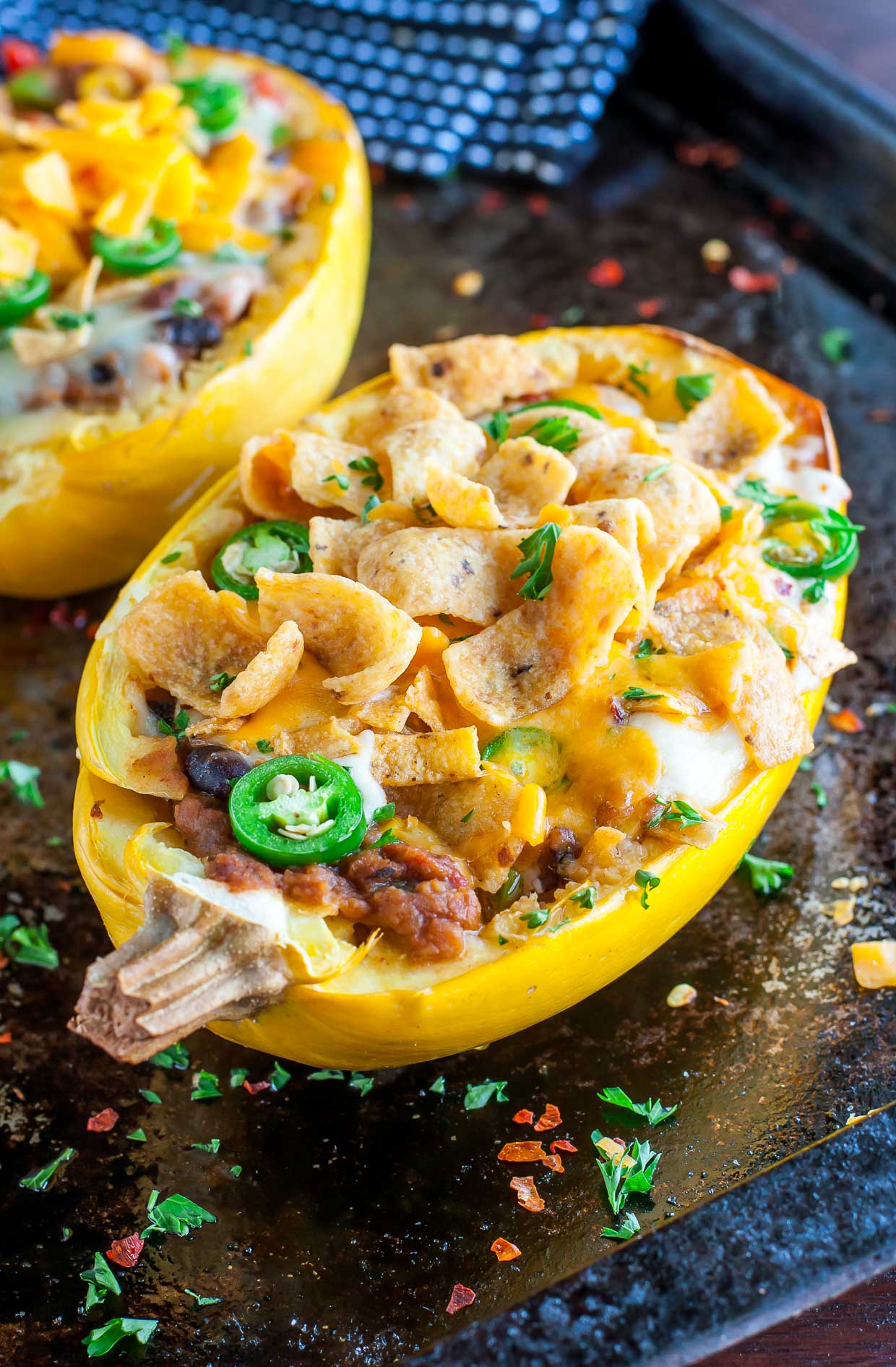 These easy cheesy Chili Stuffed Spaghetti Squash are 100% vegetarian and totally crave-worthy! 