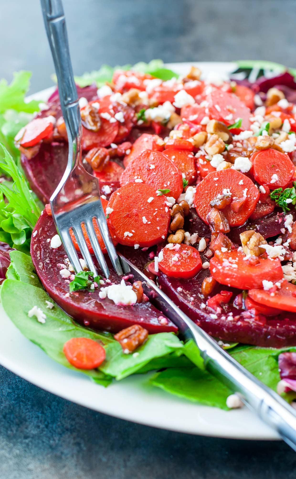 Healthy Warm Carrot Beet Spinach Salad - GF + Vegetarian - Swap out the feta and use clarified butter for a dish that's both paleo friendly and Whole 30 compliant!