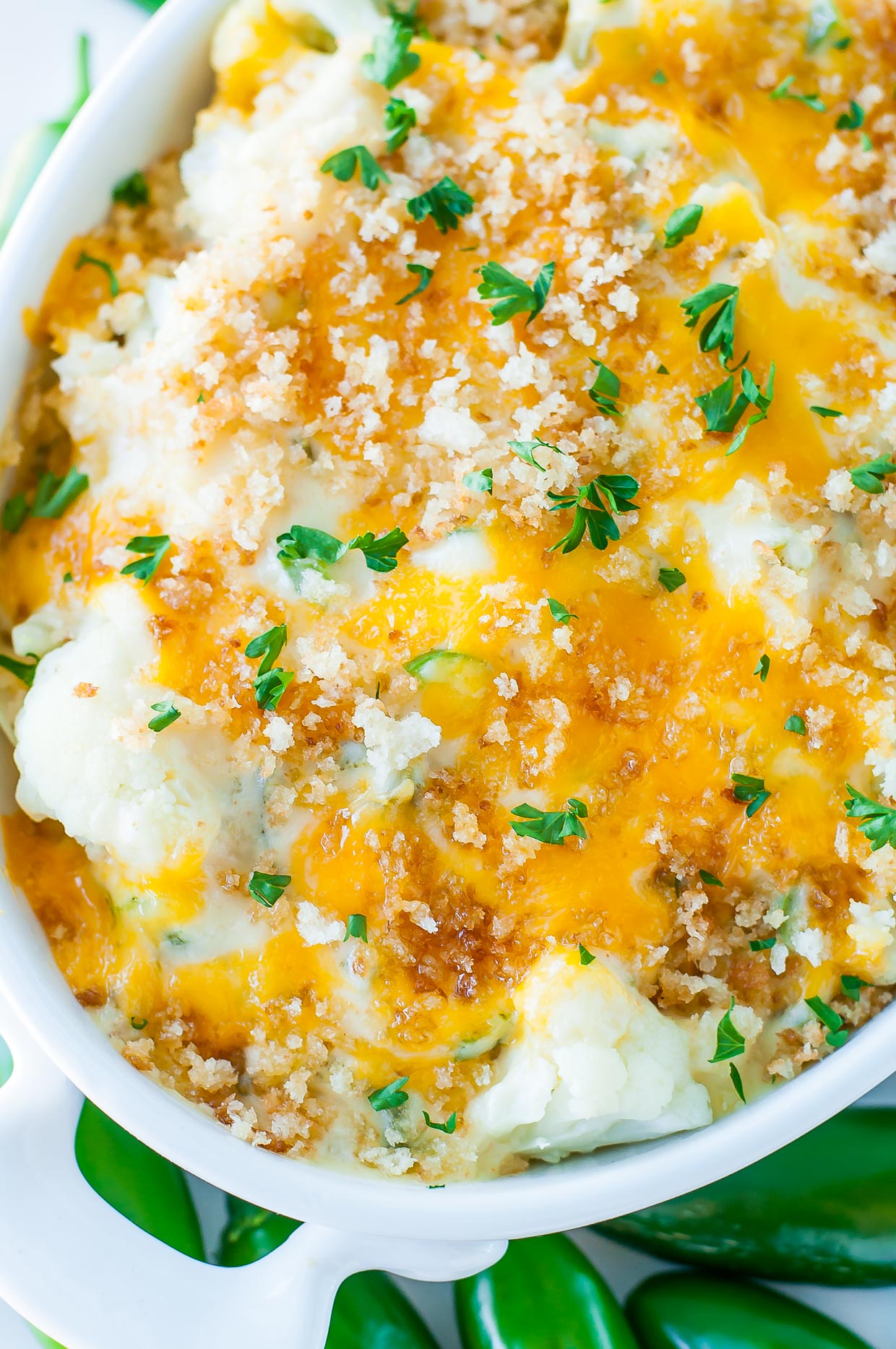 Totally unconventional and wildly delicious, this Creamy Cauliflower Jalapeño Popper Casserole is an easy cheesy veggie gratin with a kick!