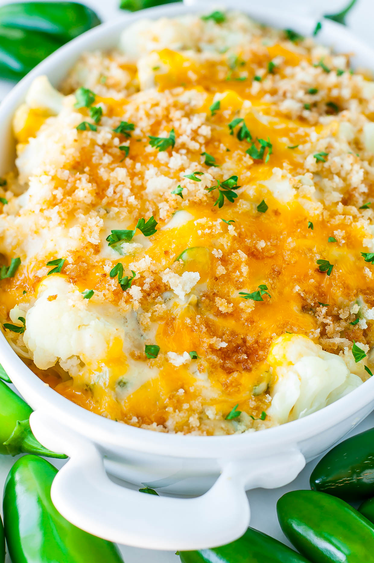 Totally unconventional and wildly delicious, this Creamy Cauliflower Jalapeño Popper Casserole is an easy cheesy veggie gratin with a kick!