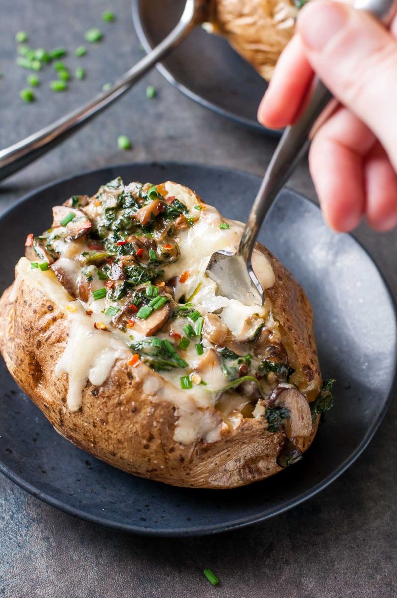Cheesy Vegetarian Loaded Baked Potatoes with Spinach and Mushrooms
