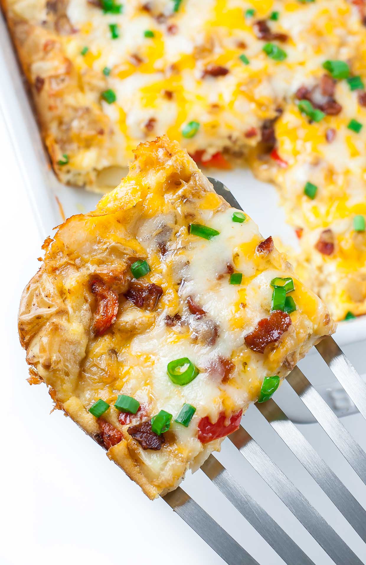 This easy Cheesy Roasted Potato Breakfast Bake is a tasty way to sneak veggies into your breakfast! Served up casserole style, it's great for holidays or a brag-worthy brunch with family and friends.