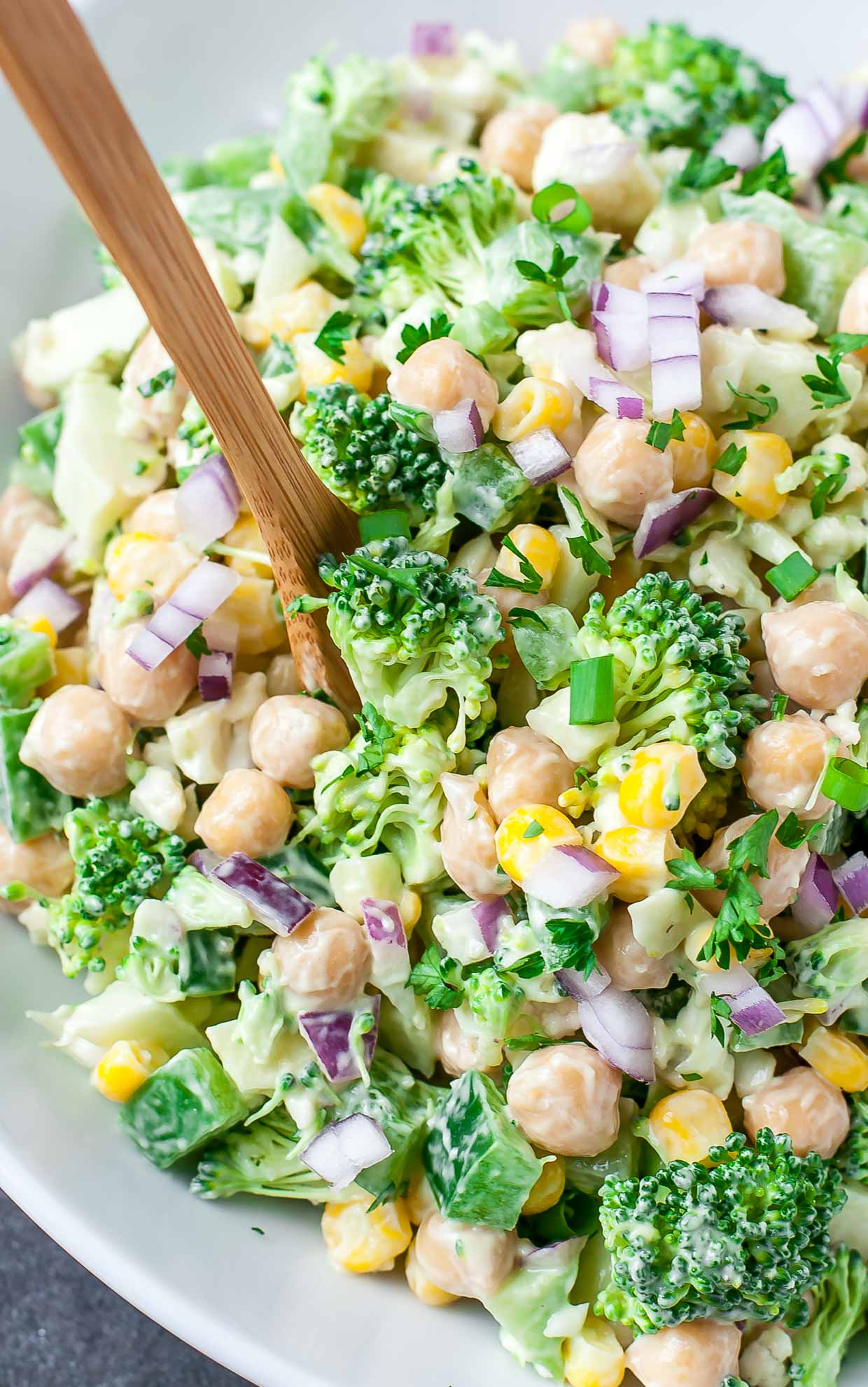 Featuring a tasty medley of broccoli, cauliflower, corn, and chickpeas, this chopped cauliflower broccoli salad with creamy avocado dressing is ready to rock your portable lunch game. Perfect for parties, potlucks, picnics, and a tasty on-the-go lunch!