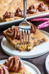 Homemade Sheet Pan Cookie Cake Recipe - This classic chocolate chip cookie cake is a total game changer in sheet pan form! Serves a crowd.