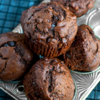 These Bakery-Style Double Chocolate Banana Muffins are fabulously fluffy and flavorful!