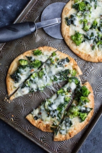 This cheesy broccoli kale pesto pizza uses store bought flatbread for a fast and flavorful personal pizza, perfect for busy weekdays!
