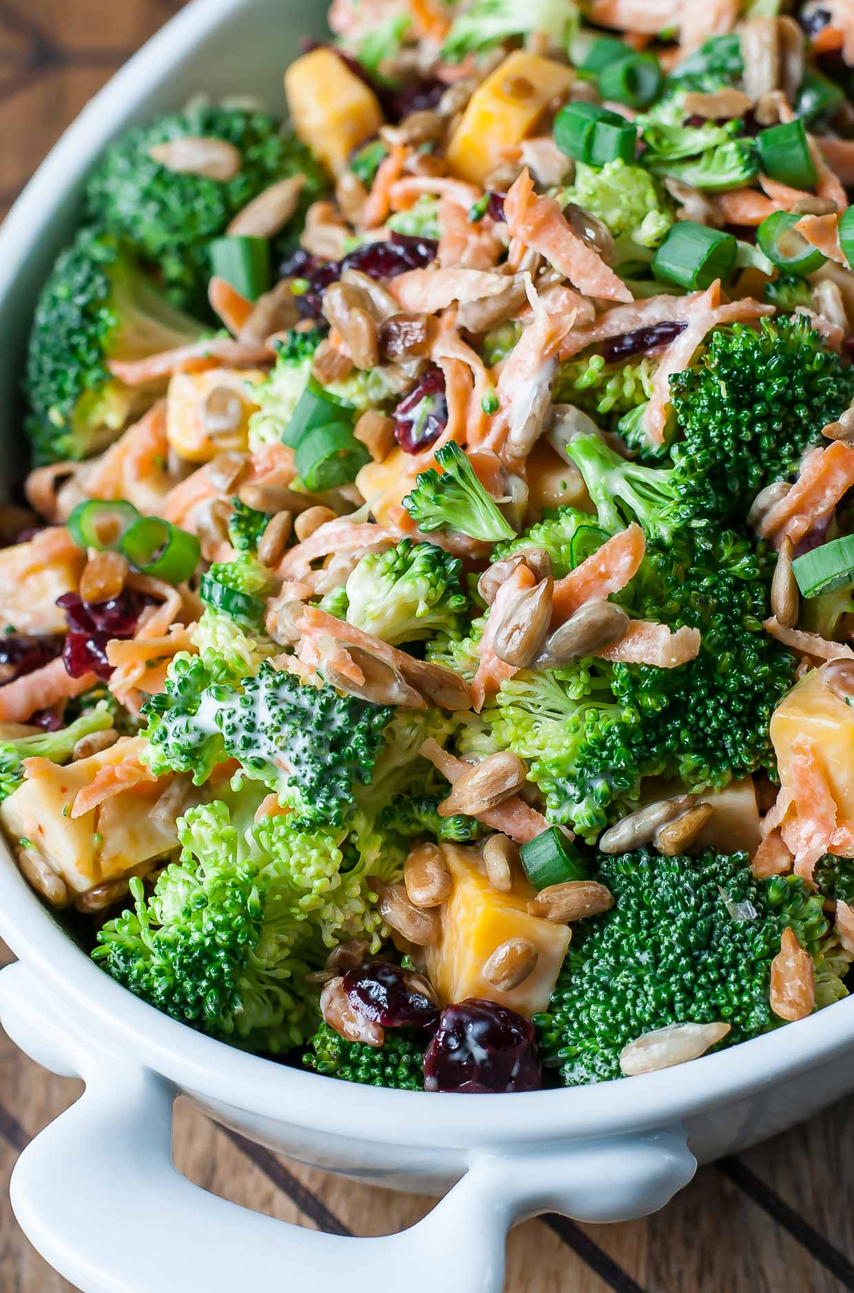 Classic Broccoli Salad with cranberries, carrots, and tasty lightened-up homemade dressing.