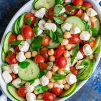 We're crazy for this Tomato Mozzarella Chickpea Salad. This quick and easy dish is full of flavor and a breeze to toss together!