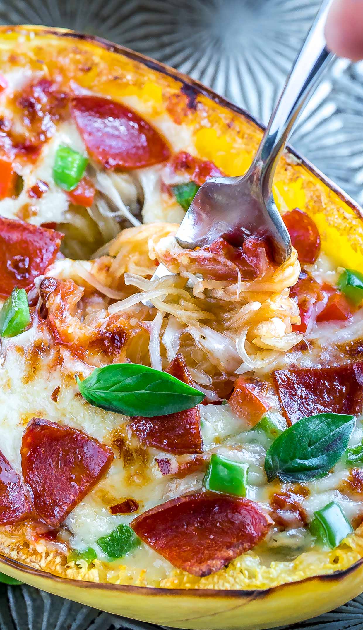 Whip up these Veggie Lover's Spaghetti Squash Pizza Boats for a low-carb + gluten-free pizza night of epic proportions!