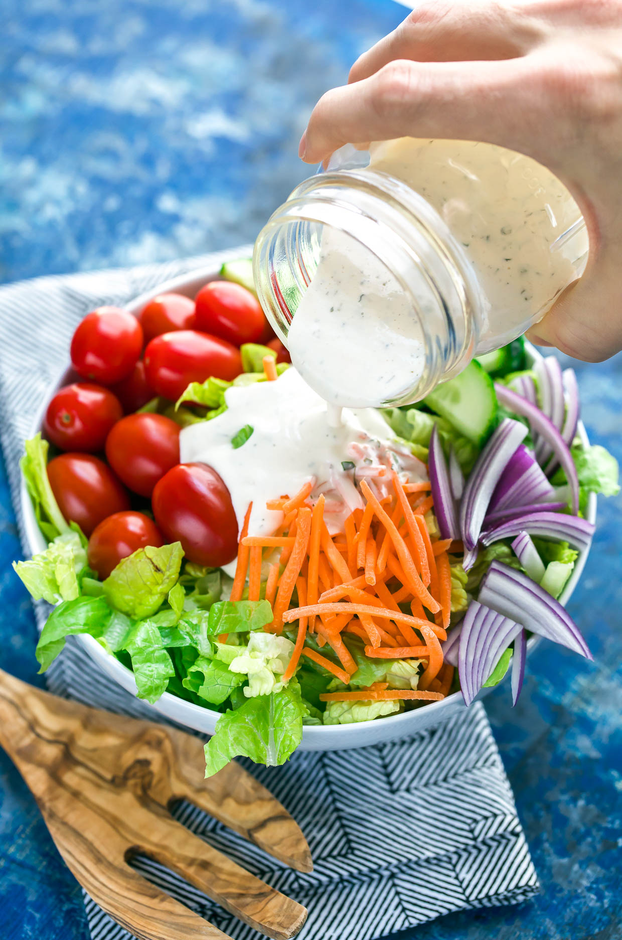 Ditch the sketchy processed bottled dressing and whip up this super quick, super easy, homemade paleo ranch dressing! Whole30 Compliant + Gluten-Free