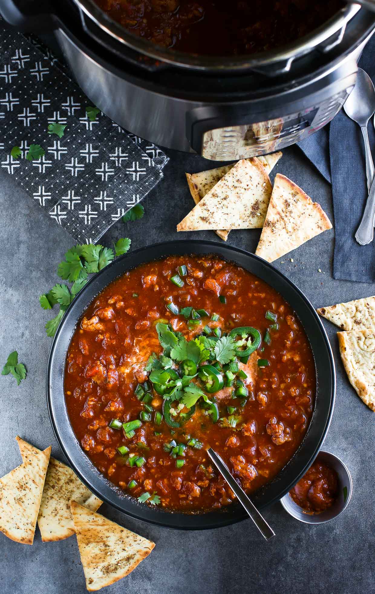 spicy harissa turkey chili in bowl with instant pot pressure cooker