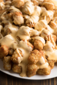 Cheesy Tater Tot Nachos with Queso on Top