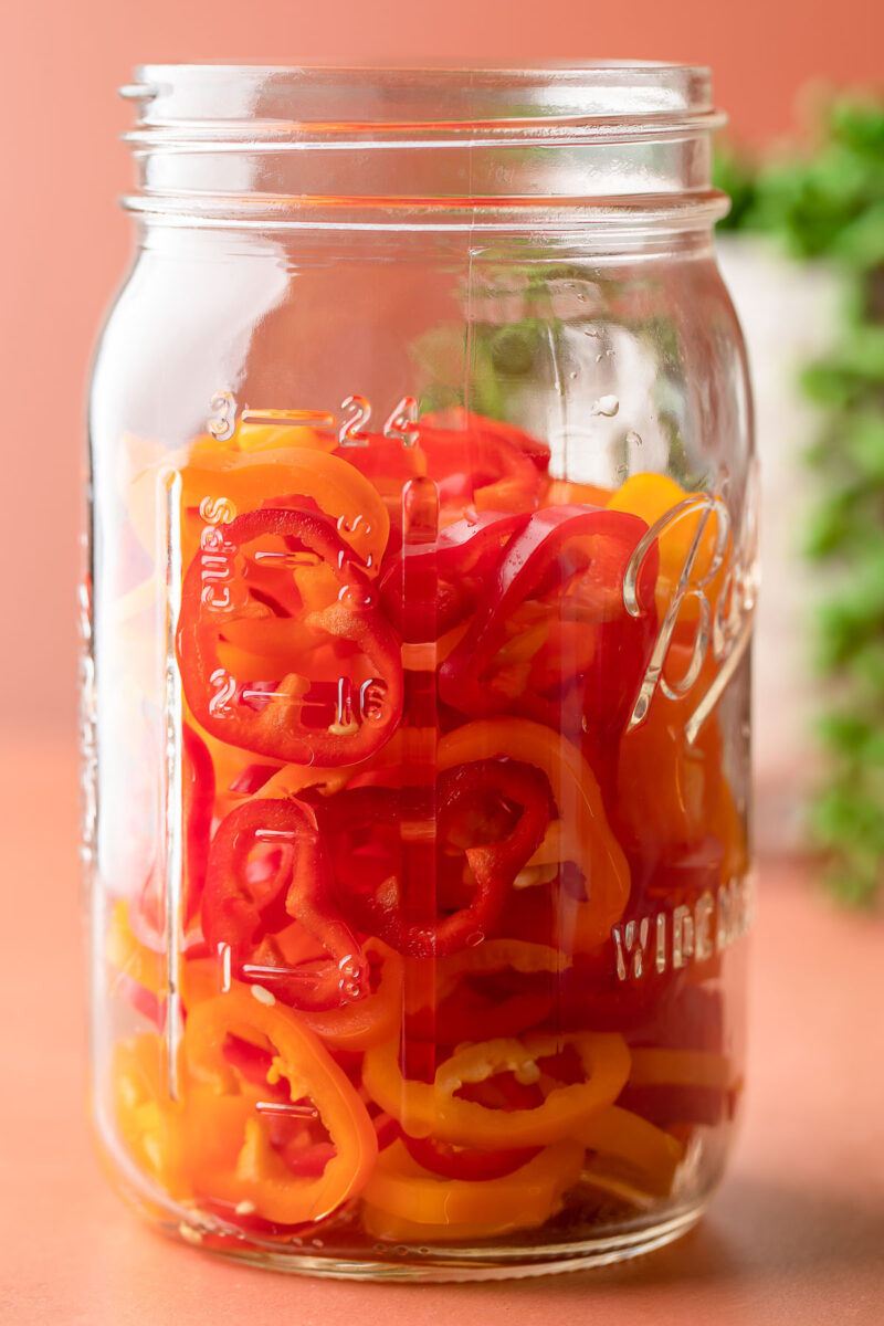 mason jar with sliced sweet mini peppers