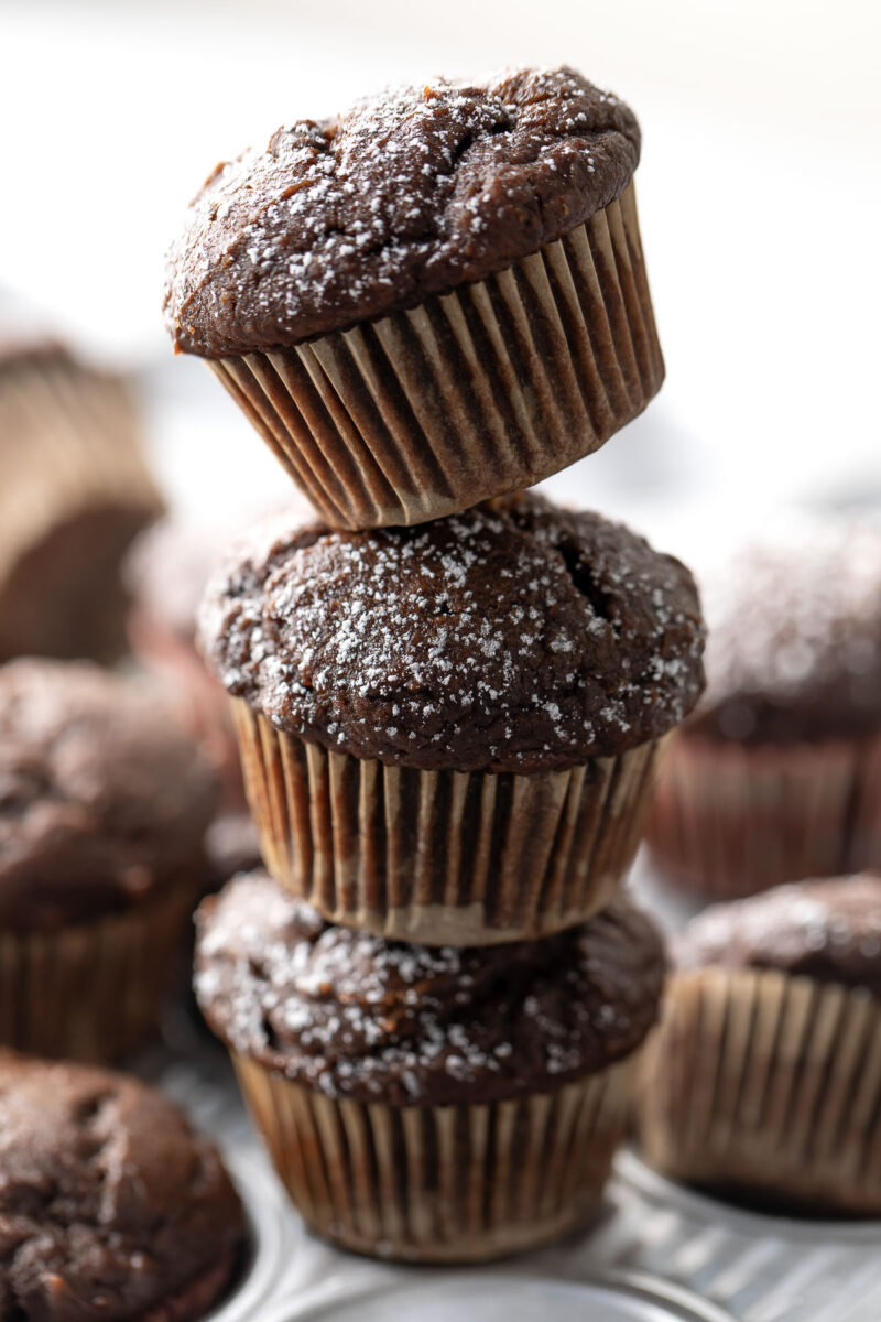 Stack of Mini Chocolate Muffins with Powdered Sugar