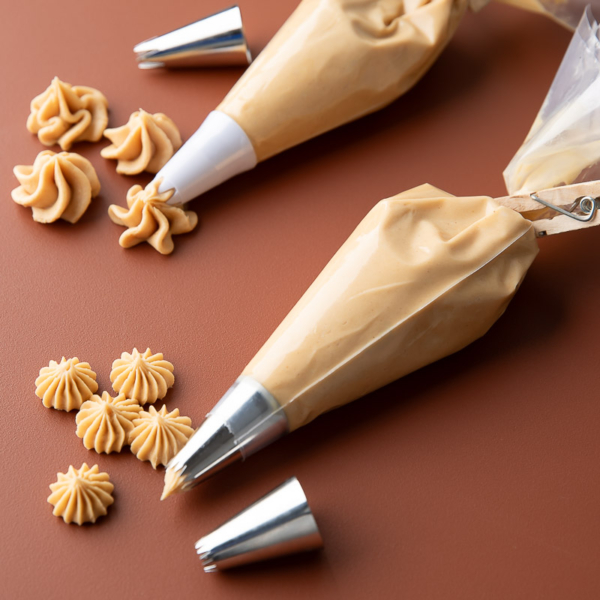 Peanut Butter Buttercream Frosting in Piping Bags with Assorted Tips