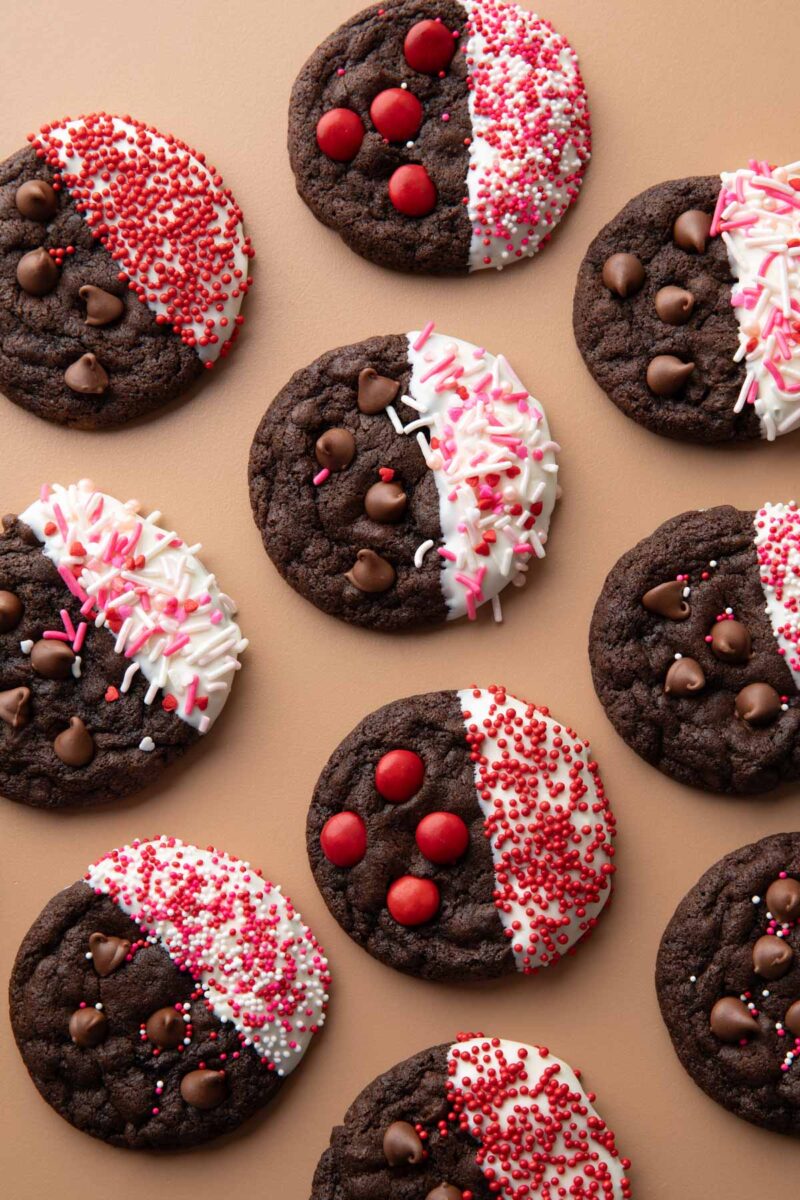 white chocolate dipped chocolate cookies with valentine's day themed sprinkles