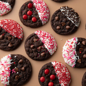 white chocolate dipped cookies with chocolate chips, M+M candies, and sprinkles