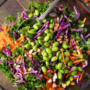 bowl of Kale Cabbage Salad with edamame and carrots