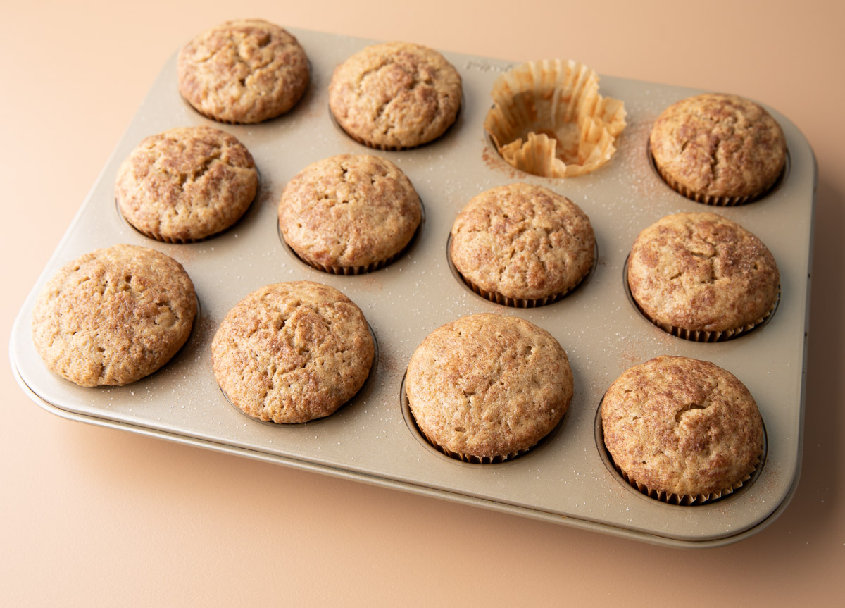 baked banana applesauce muffin in a muffin tin