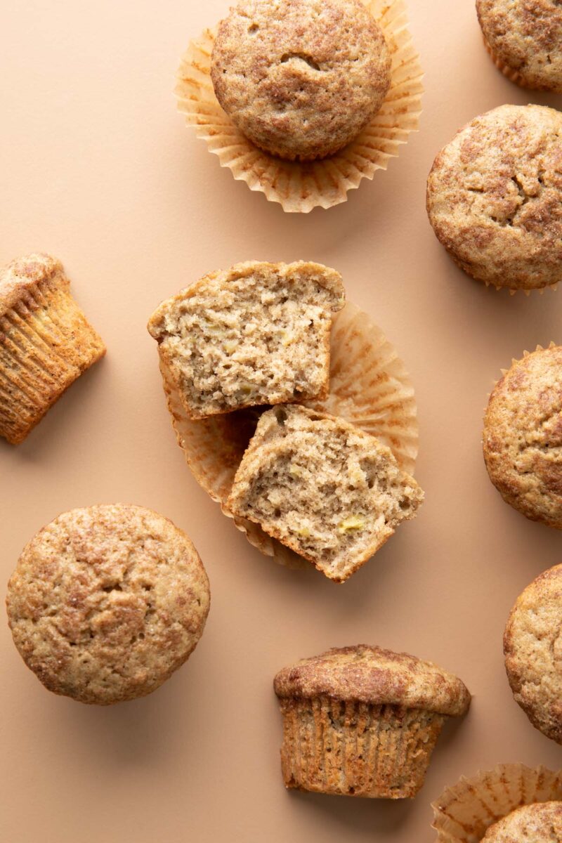 assorted muffins torn in half to show soft and fluffy texture