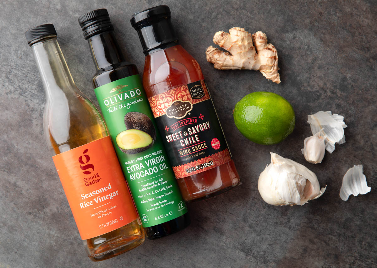 sweet chili dressing ingredients: ginger, lime, garlic, sweet chili sauce, avocado oil, and seasoned rice vinegar